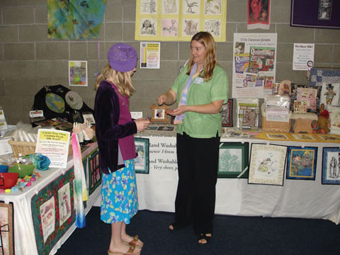 [Val answers a girl's questions at the show]